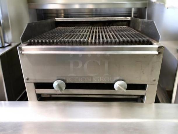 Commercial countertop gas charbroiler, 24–36", outstanding condition, features durable design with control knobs. Fully tested.