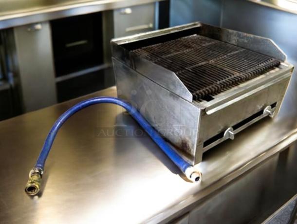 Standard 24–36" commercial gas charbroiler in outstanding condition, fully tested, includes blue gas hose.