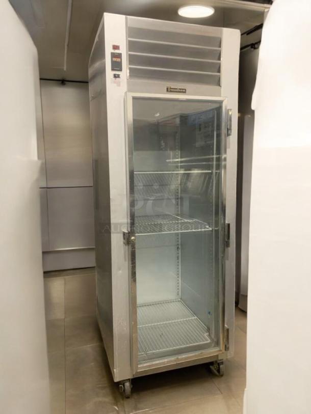 Prime condition Traulsen G11010 single-door commercial refrigerator, fully tested, with glass door and interior shelves.