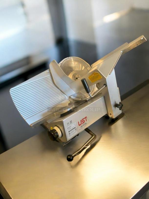 Bizerba GSP HD meat slicer, silver, prime condition, 120V, fully tested, adjustable thickness knob, labeled with model details.