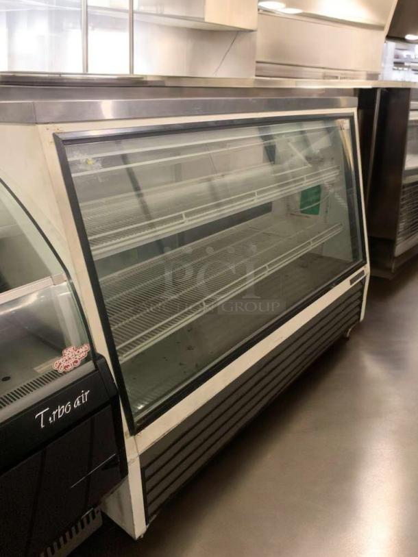 True GDM-71-SL-HC-TSL01 triple door commercial glass cooler, 71 cu.ft, excellent condition, fully tested, shelving visible.