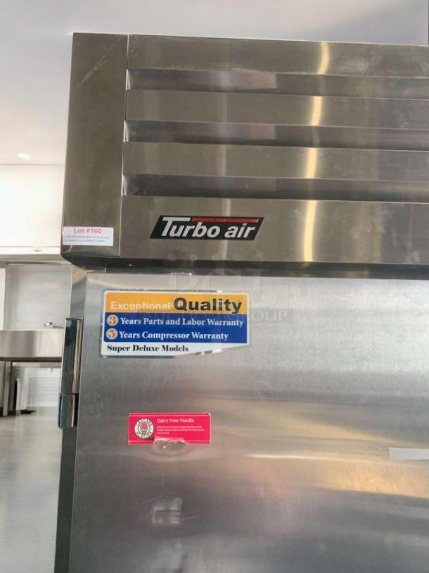 Turbo Air PRO-50F double door commercial freezer, stainless steel, excellent condition, quality and warranty labels visible.