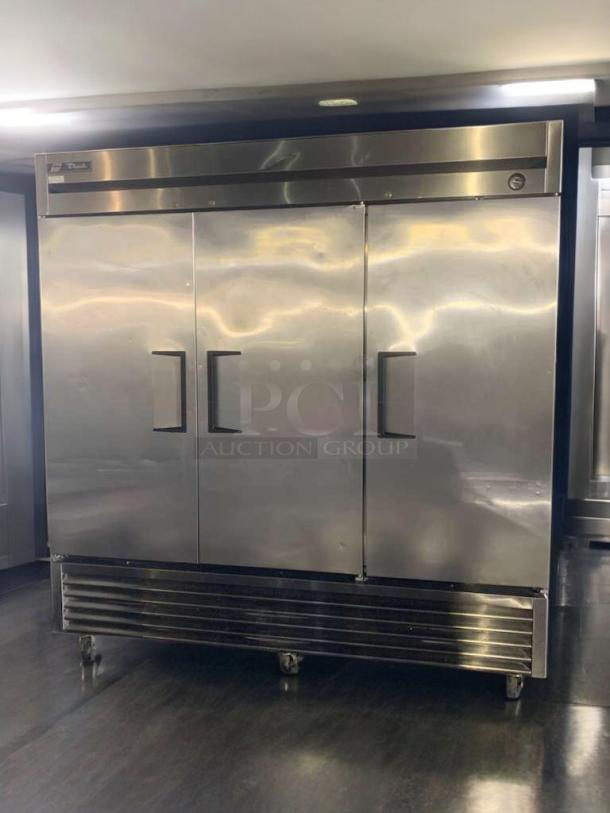 True T-72 three-door commercial refrigerator, 115V, prime condition. Stainless steel exterior, fully tested, True logo visible.