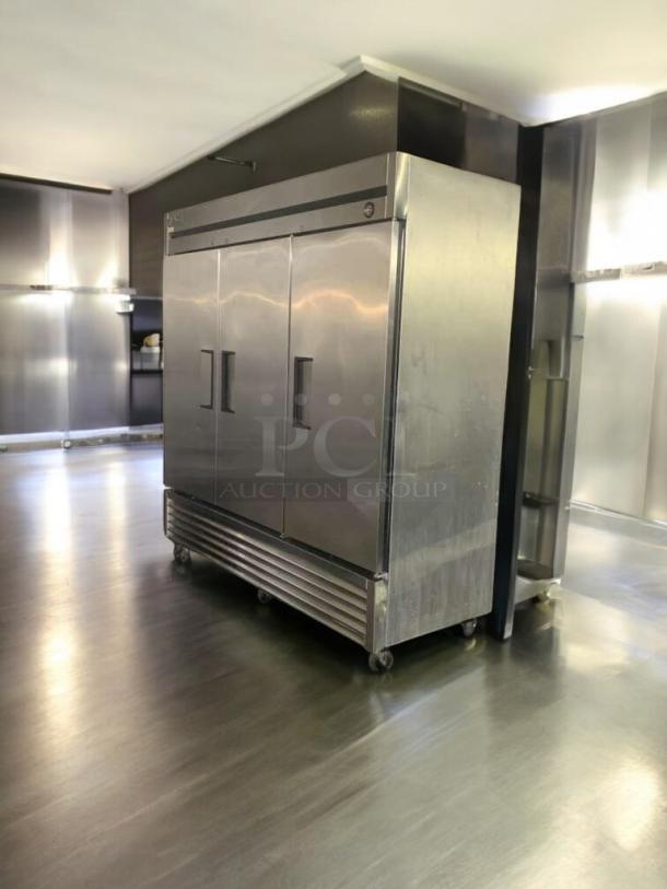 True T-72 three-door commercial refrigerator, stainless steel, prime condition, fully tested, 115V, on casters.