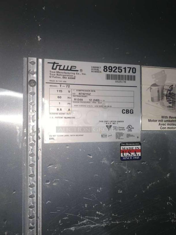 Label on True T-72 refrigerator showing specifications: 115V, 60Hz, refrigerant R134A. Made in USA by True Manufacturing Co.