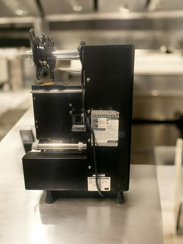 Prime condition WANTJOIN WZ-95B automatic cup sealing machine, 110–120V, fully tested and working. Visible labels detail settings and features.