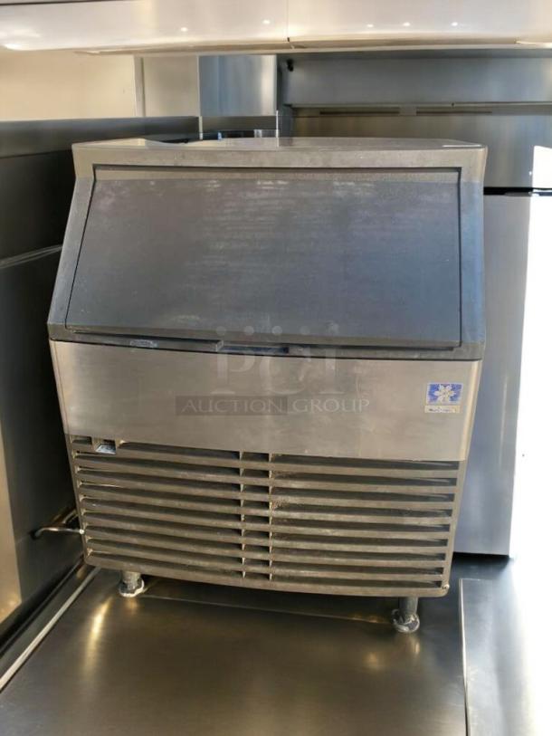 Manitowoc QD0272A ice maker, prime condition, 115V. Fully tested, stainless steel, visible branding, durable design.