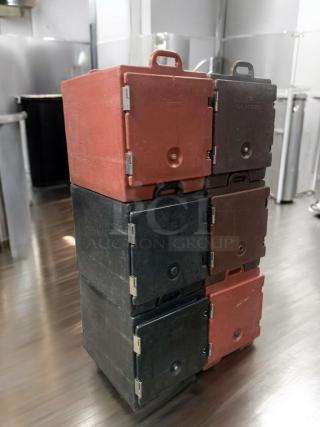 Prime Condition Cambro UPC Series insulated food carriers stacked, red and black, fully operational, ideal for hot/cold transport.