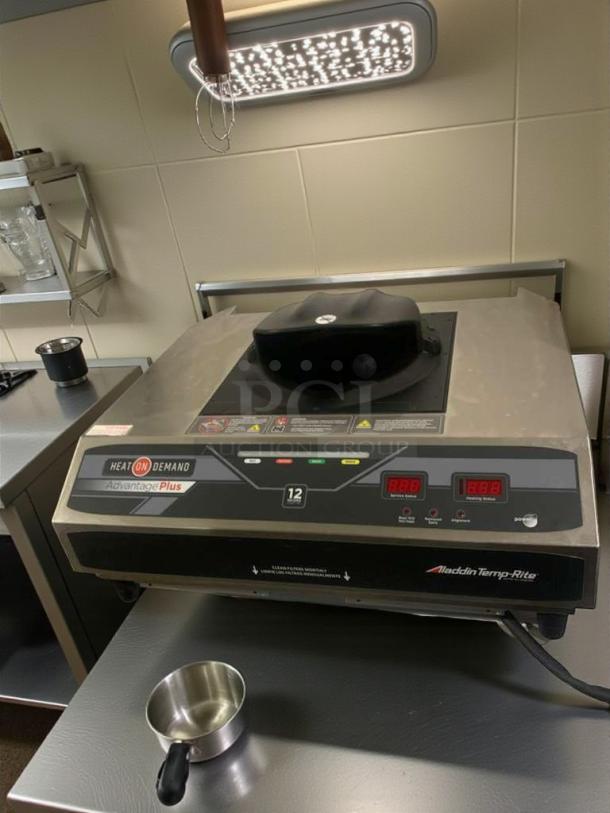 Aladdin Temp-Rite ADV700 tray heater, prime condition. Features digital display, controls, and "Heat On Demand" branding. Fully tested.