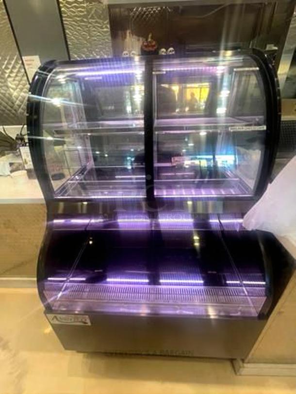 Avantco refrigerated bakery display case, model 424BAC31, with curved glass, prime condition, and tested working.