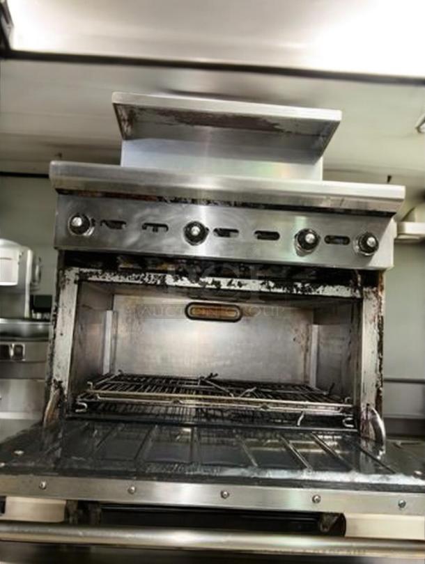 Wolf Range Model 634-923, 36" natural gas griddle with standard oven, stainless steel, fully tested, prime condition.