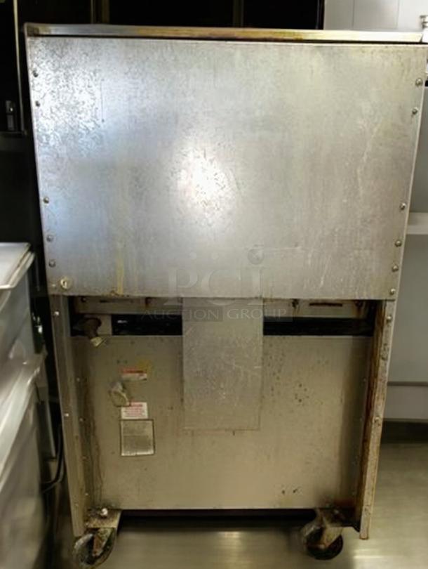 Wolf Range Model 634-923, 36" natural gas griddle with standard oven, prime condition, fully tested, visible scratches, back view.