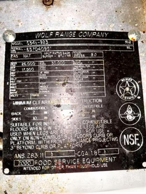 Wolf Range Company Model 634-923 label. Details gas specs, clearance, NSF certified. For commercial use, tested and working.