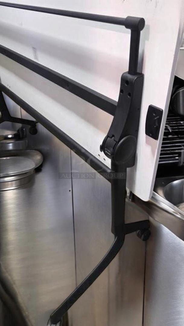 Flip-top training/conference table with locking casters, shown flipped up. Prime condition, fully functional. Black frame.