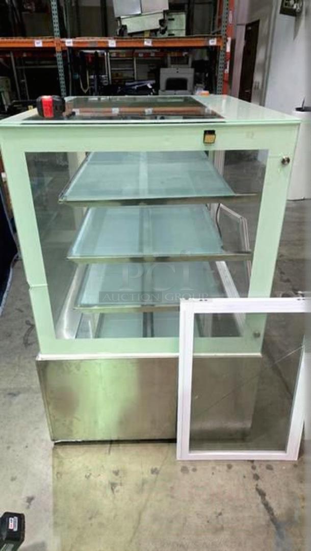 Commercial bakery enclosed display case in remarkable condition, featuring glass shelving, stainless steel base, fully tested and working.