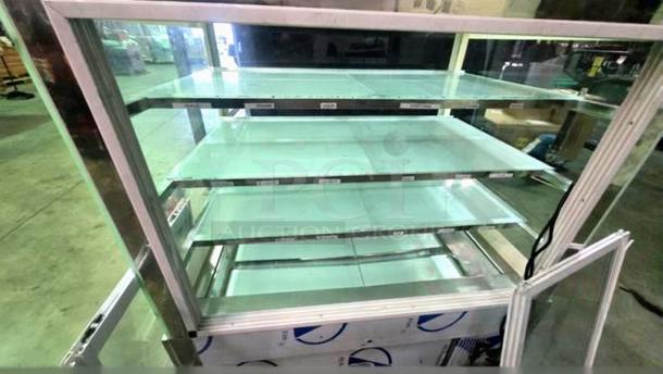 Commercial bakery enclosed display case with glass shelves, in remarkable condition, fully tested and working.