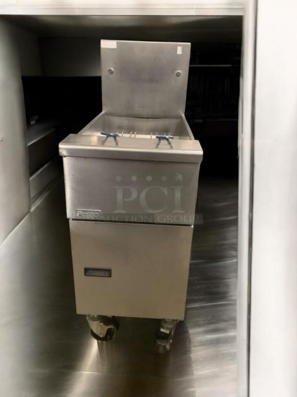 Pitco VF35 natural gas fryer in impeccable condition, featuring 70,000 BTU, stainless steel body, and mounted on casters.