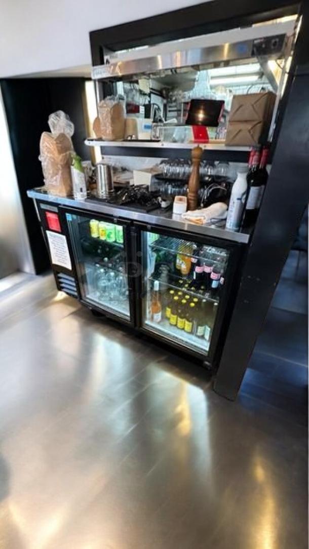 Pristine True TBB-24-48G-HC back bar refrigerator, double glass doors, fully tested, excellent condition.