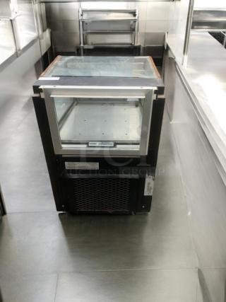 Cal-Mil Concepts Model 2017R refrigerated display case in great condition, glass front, tested and working, 120V power.