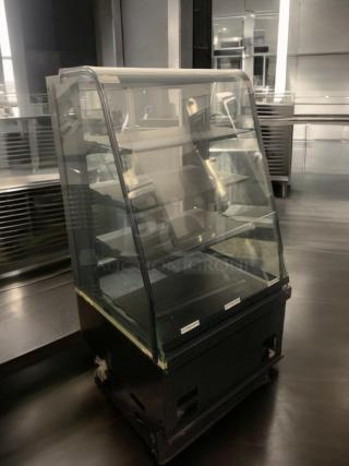 Commercial refrigerated display case with curved glass, multi-shelf design, superior condition, tested and fully operational.