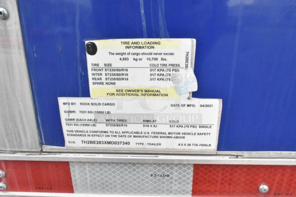 Sticker on Cruising Kitchens trailer shows tire and loading info, manufacturer: Rock Solid Cargo, GVWR: 15,500 lb, MFG: 04/2021.