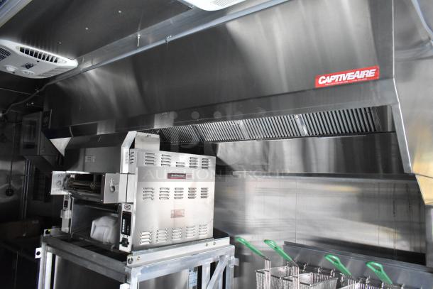 2021 Cruising Kitchens 24' Burger King fast food trailer with CaptiveAire grease hood, Nieco broiler, and Frymaster fryer.