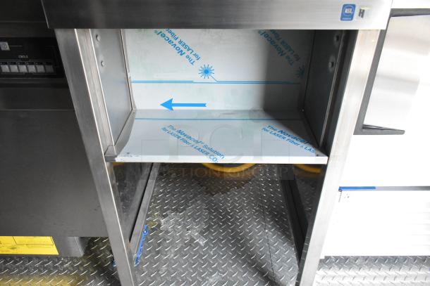 Brand new Cruising Kitchens 2021 Burger King mobile kitchen trailer interior. Visible diamond plate flooring and stainless steel surfaces.