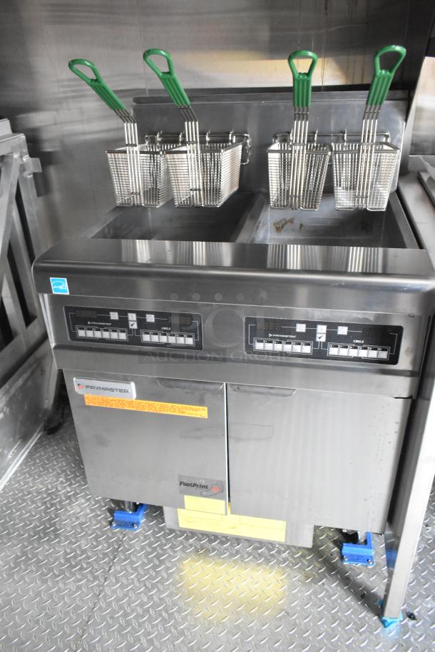 Frymaster 2-bay commercial fryer with baskets inside 2021 Cruising Kitchens Burger King mobile fast food trailer.
