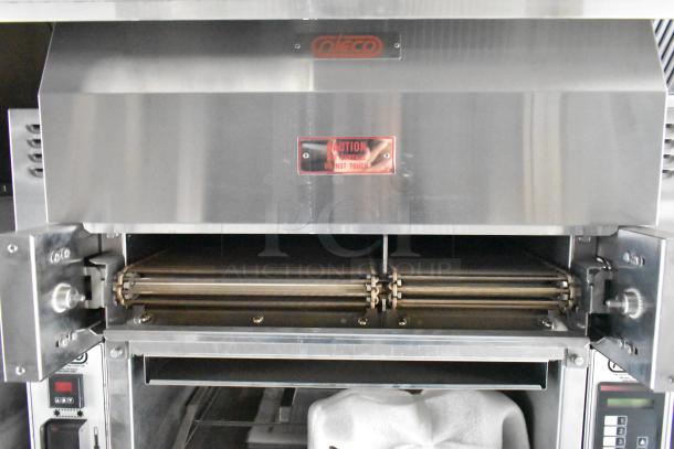 Nieco broiler in a Cruising Kitchens mobile kitchen trailer, featuring stainless steel finish and caution label.