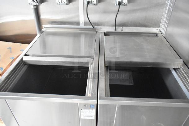 Stainless steel commercial freezers inside a 2021 Cruising Kitchens Burger King mobile kitchen trailer, brand new condition.