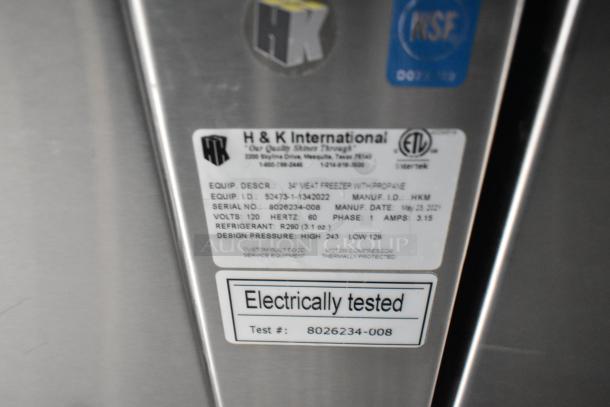 H&K International label on meat freezer. Details: 34" Meat Freezer with Propane, Model HKM, electrically tested.
