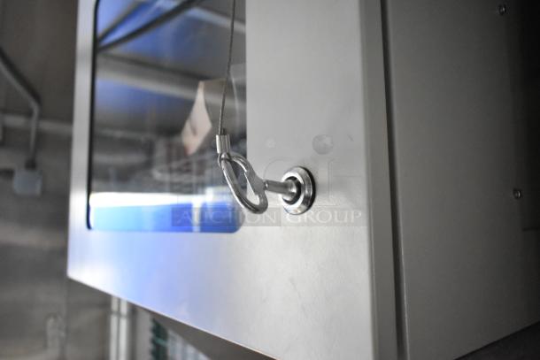 Interior view of a 2021 Cruising Kitchens 24' Burger King mobile kitchen trailer, showing a secured cabinet detail.