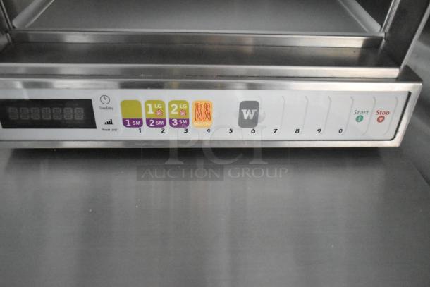 Control panel of a commercial kitchen appliance in a 2021 Cruising Kitchens Burger King trailer with labeled buttons.