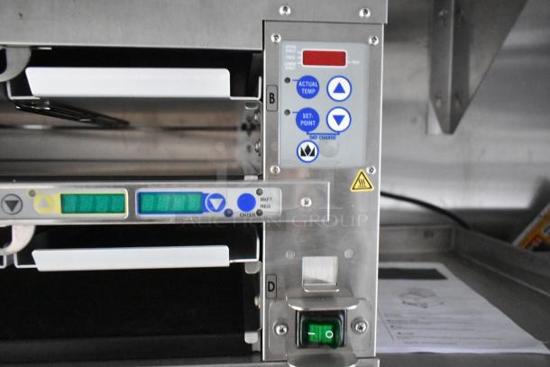 Temperature control panel with buttons and display on commercial kitchen equipment. Includes settings like actual temp and set-point.