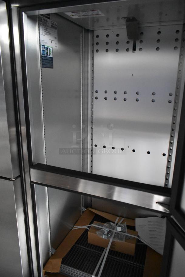 Interior of a new 2021 Cruising Kitchens mobile kitchen trailer, featuring shelving and packaging materials.
