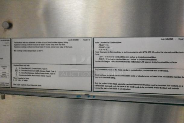 Chrome exhaust hood label showing safety and installation instructions for a Cruising Kitchens mobile kitchen.