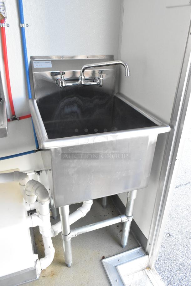 Stainless steel sink with faucet in Nationwide 24' cold food and beverage trailer, featuring commercial plumbing and clean finish.