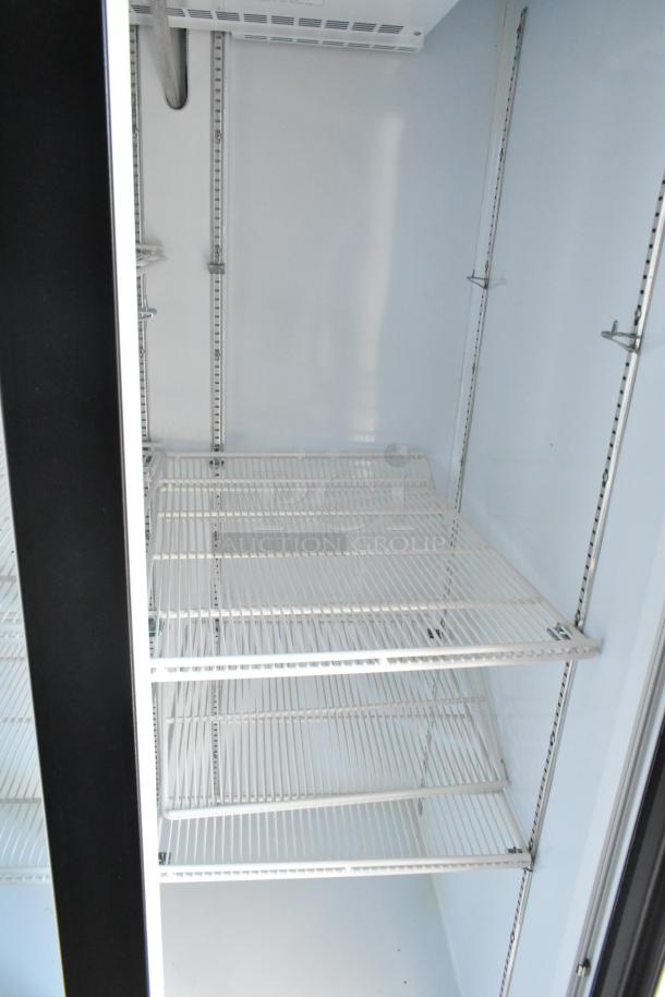 Interior view of commercial Beverage Air cooler with wire shelving in brand new condition.