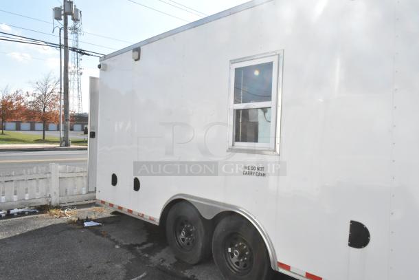 Exterior of a 24' unbranded Nationwide trailer with side window, dual axles, and "We Do Not Carry Cash" signage.