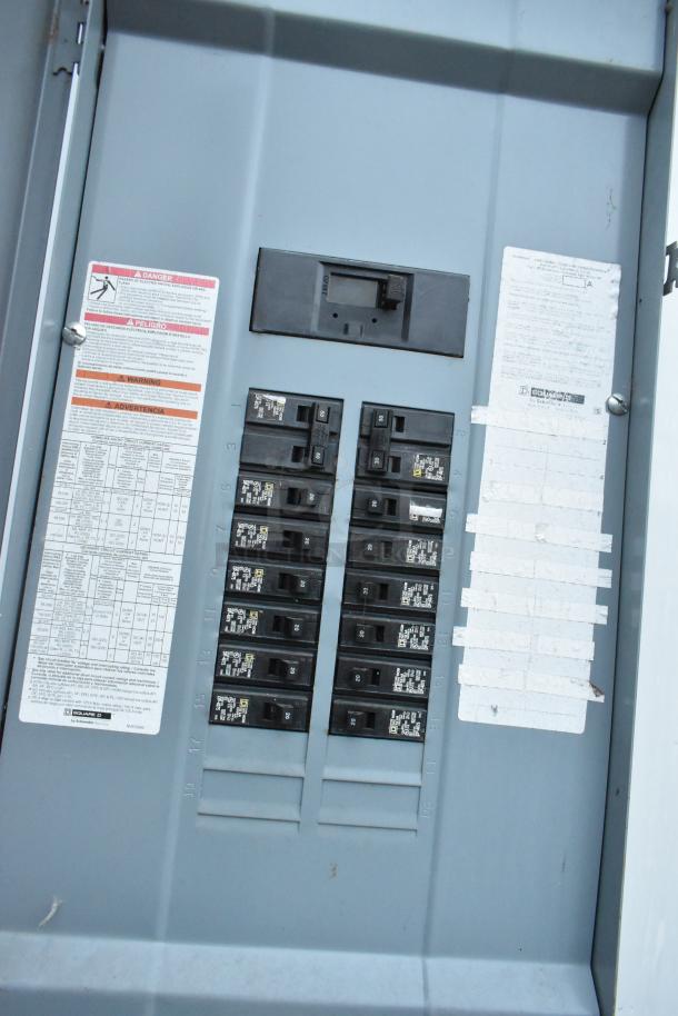 Electrical panel inside a Nationwide 24' food and beverage trailer, showing breakers and panel labels.