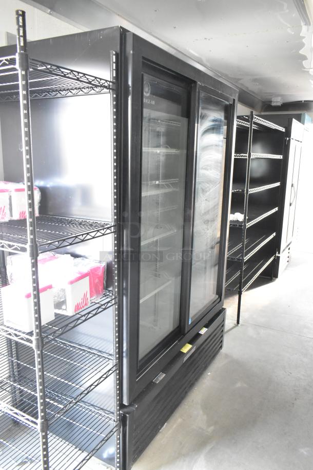 Inside view of an unbranded 24' cold food retail trailer featuring commercial-grade Beverage Air coolers, shelving, and storage space.
