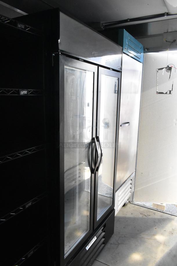 Commercial-grade food retail trailer interior showing Beverage Air reach-in coolers and stainless steel fixtures.