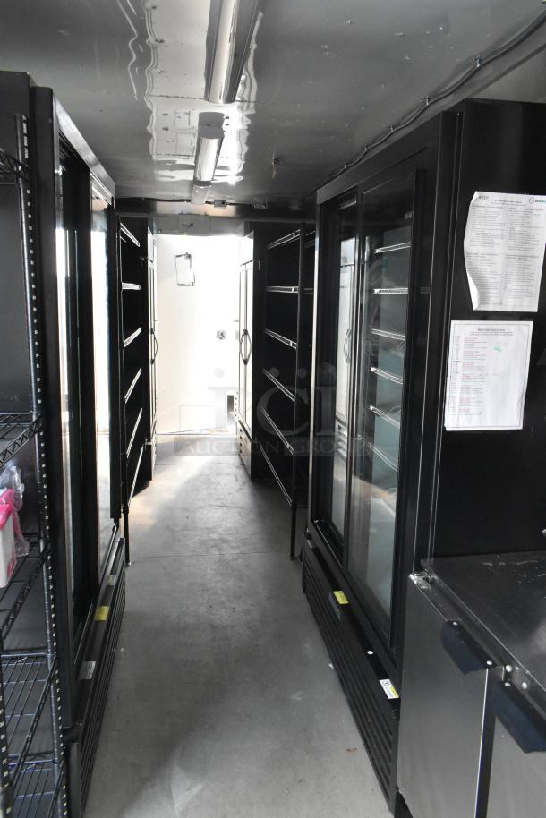 Interior view of a Nationwide 24' unbranded retail trailer with commercial grade equipment, coolers, and POS system.