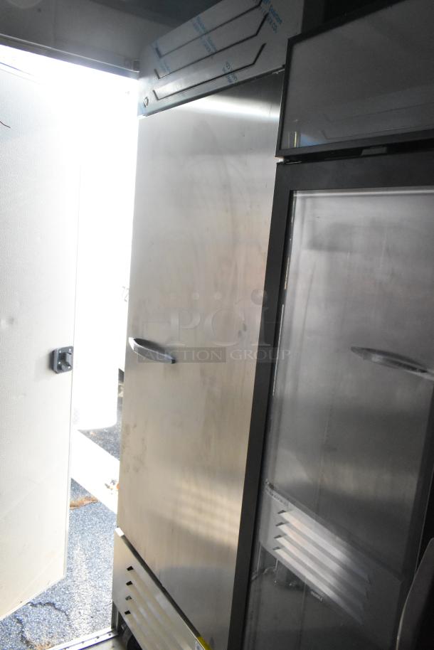 Nationwide 24' cold food trailer interior, featuring stainless steel coolers. New condition, equipped for food service.