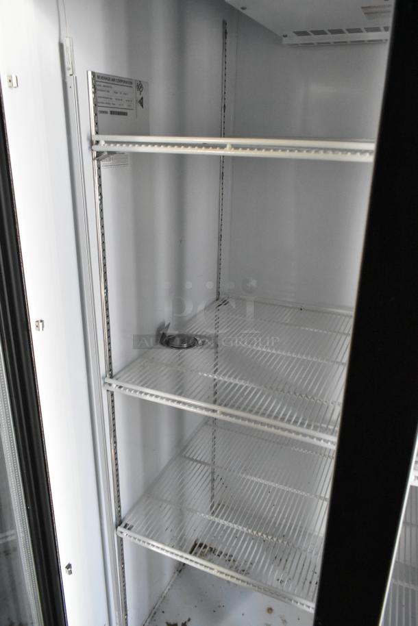 Beverage Air reach-in cooler interior with wire shelving and Beverage-Air Corporation label, part of a fully equipped retail trailer.