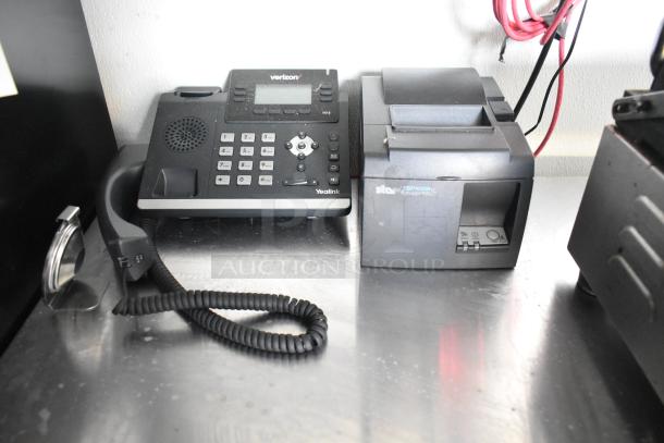 Yealink phone and Star TSP100III printer on stainless steel counter in Nationwide food trailer.