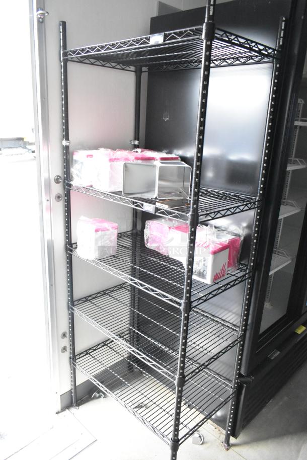 Metal shelving unit inside a Nationwide retail trailer. Shelves hold plastic-wrapped containers for cold food and beverage storage.