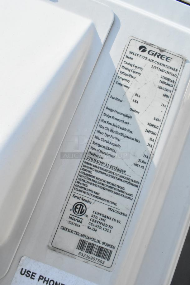 Label on Gree split type air conditioner model LIVV24HP230V1AO, detailing specifications such as cooling/heating capacity, voltage, and manufacturing date 2021.