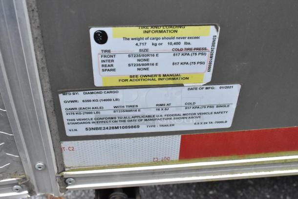 Label on a Nationwide 24' cold food trailer outlines tire and loading specs, manufactured by Diamond Cargo in 01/2021.