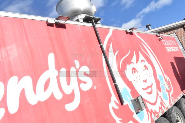 Red Wendy's truck with logo and "Quality is our recipe" motto, featuring rooftop ventilation equipment. Appears in used condition.